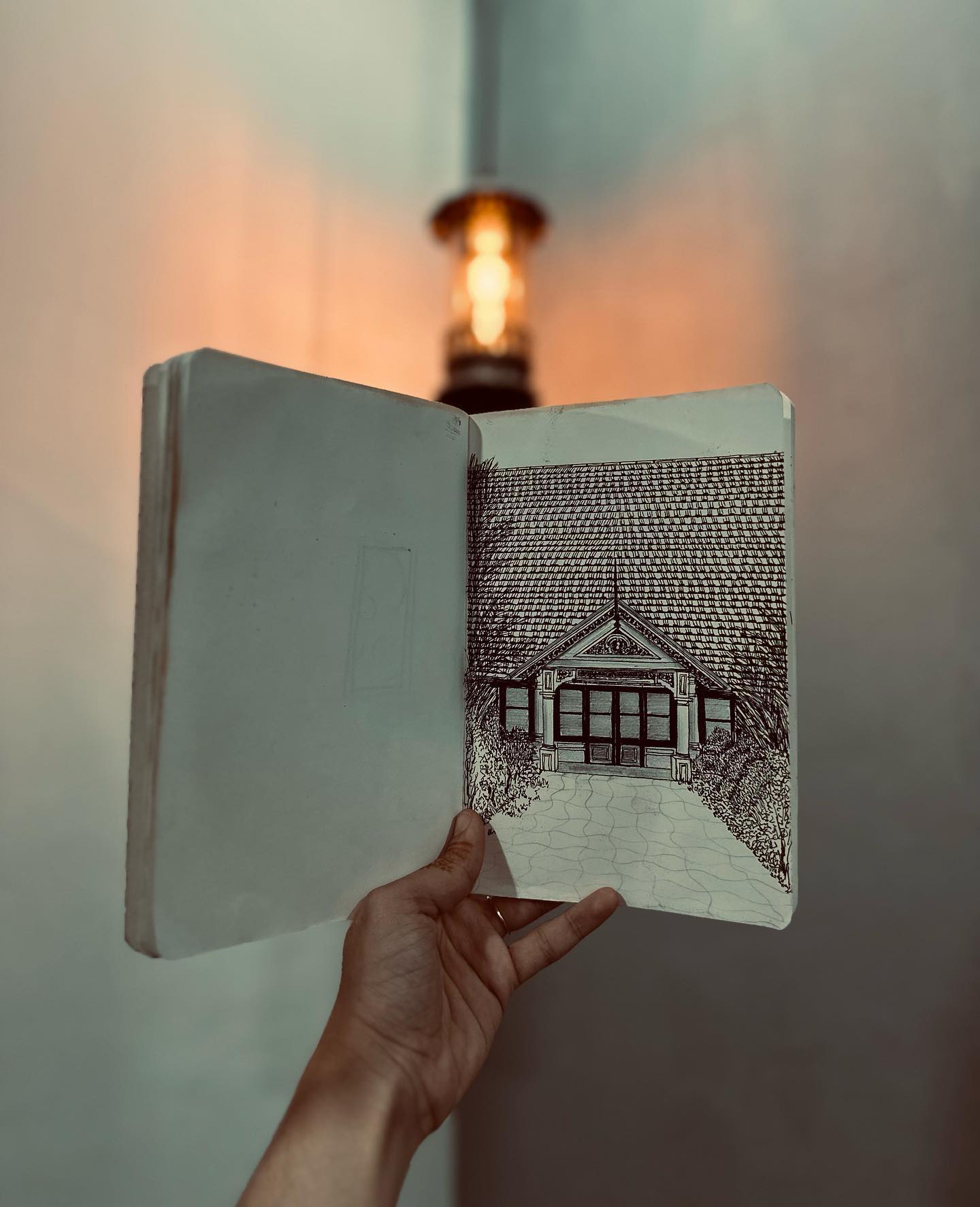 A hand-drawn sketch of a Kerala house from the studio's sketchbook