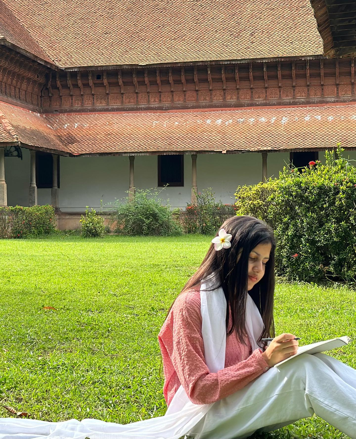 Nidhaa Ameer, co-founder, sketching in a Kerala tharavadu courtyard